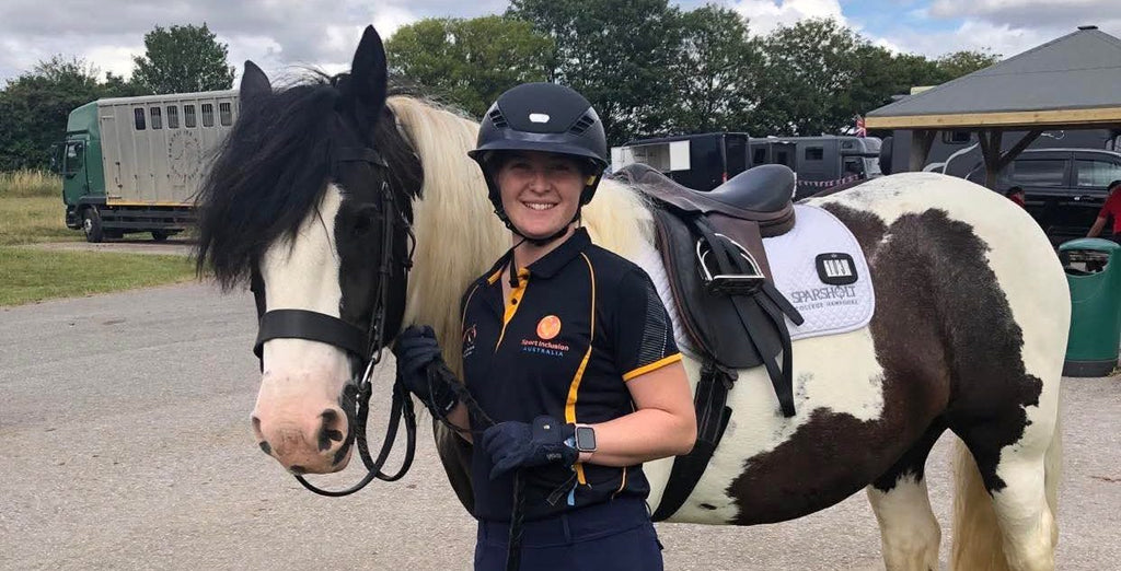 Catherine Viney at the World Virtus Games in her navy blue equestrian riding helmet