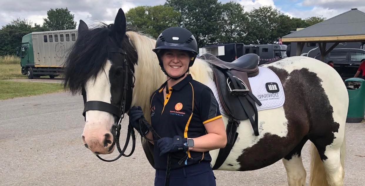 Catherine Viney at the World Virtus Games in her navy blue equestrian riding helmet